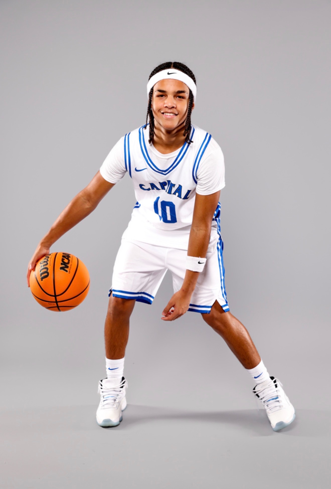 Kahsi Morgan dribbling a basketball in studio portrait