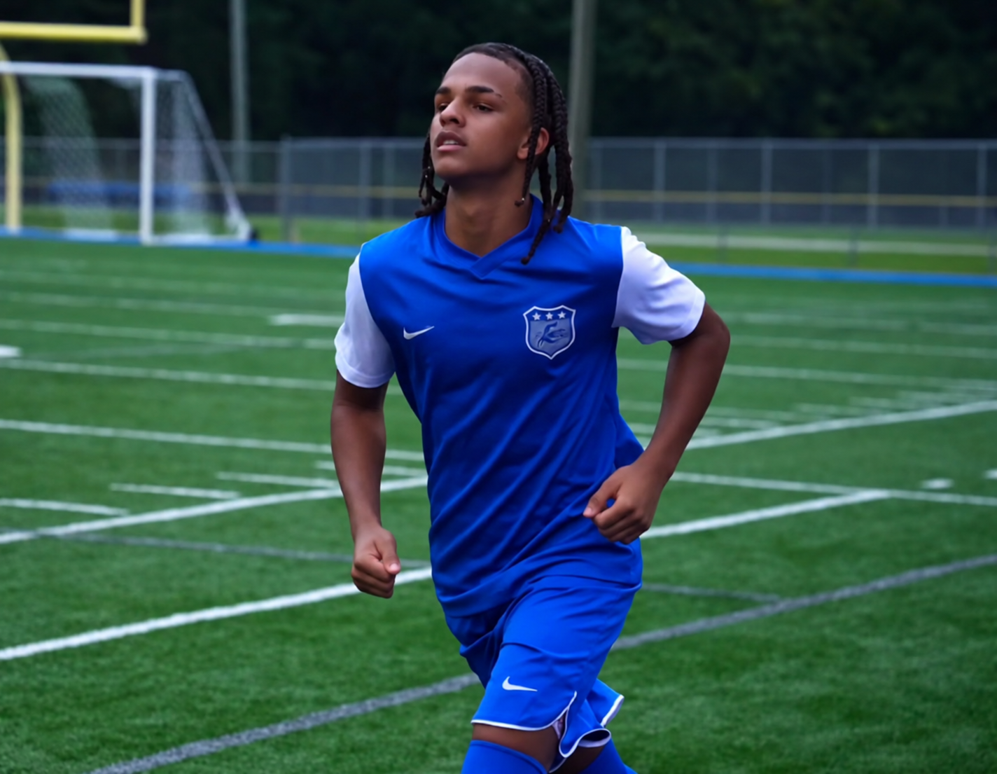 Kahsi Morgan running during soccer warmups